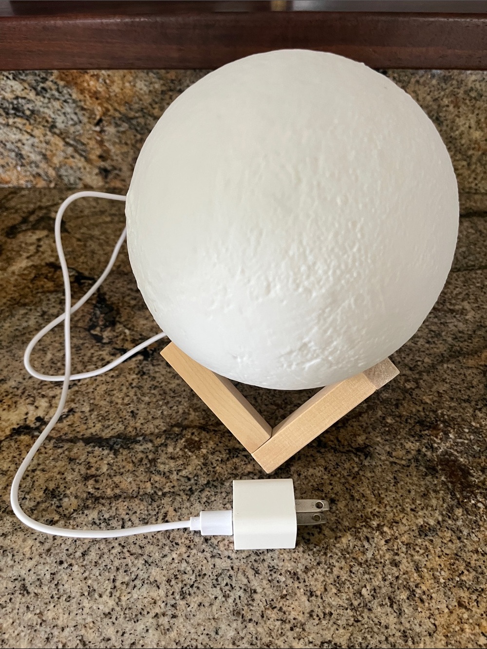 White Moon Lamp on Wooden Stand